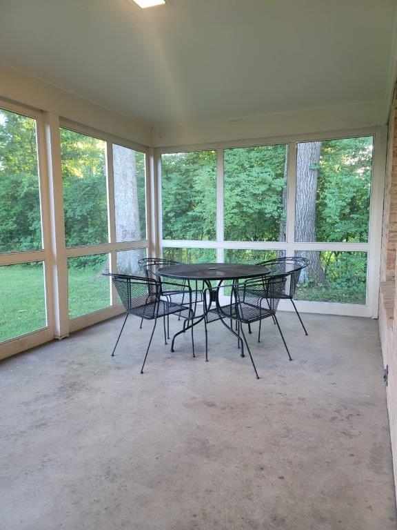 Screened patio overlooking back yard